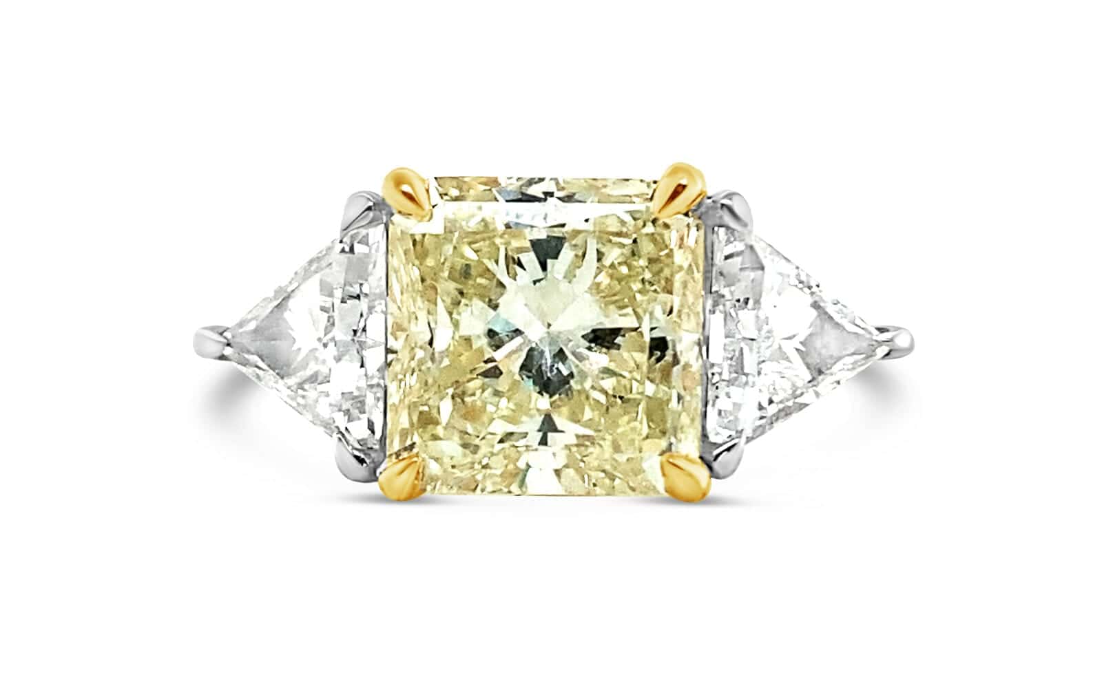 14-karat white and yellow gold engagement ring featuring a 1.81ct D SI1 oval-cut diamond, accented by 32 round brilliant diamonds, available in our Calgary showroom.